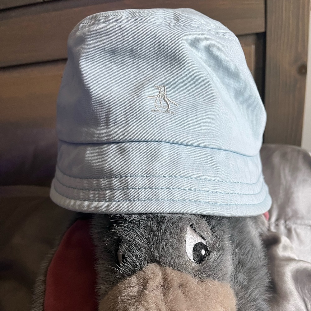 Penguin brand bucket hat, lights blue adult size.